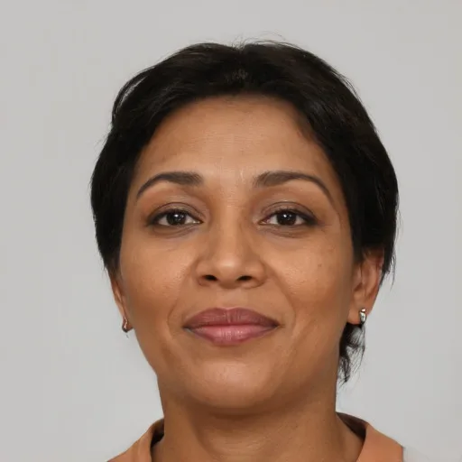 a woman in her 40s of Black descent with short dark hair, the photo they started with