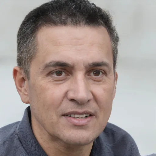 a man in his 50s with short greying hair, the photo they started with